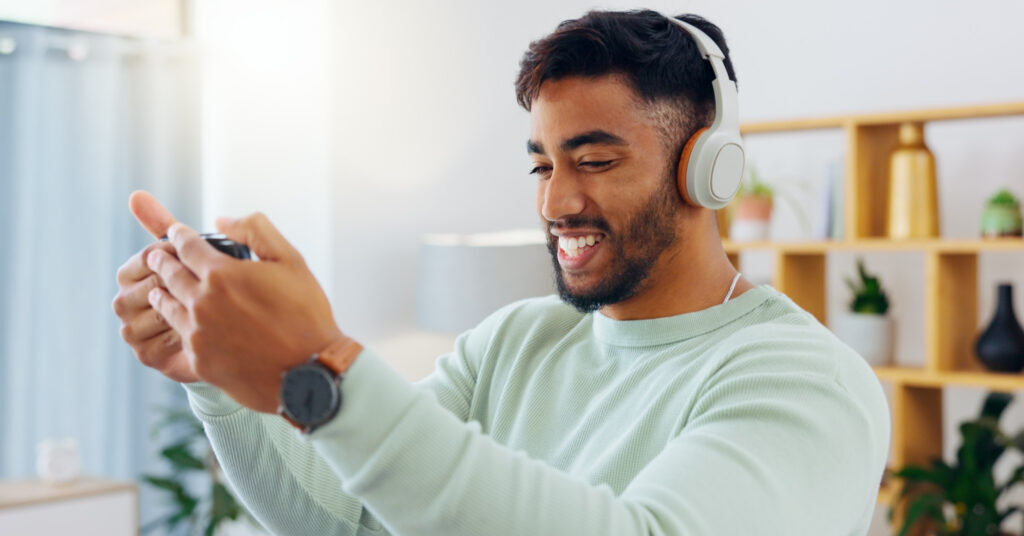 Man uses smartphone to check email.