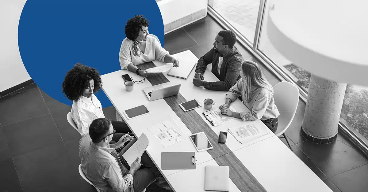 A group of marketers putting together the 2025 digital marketing trends report.
