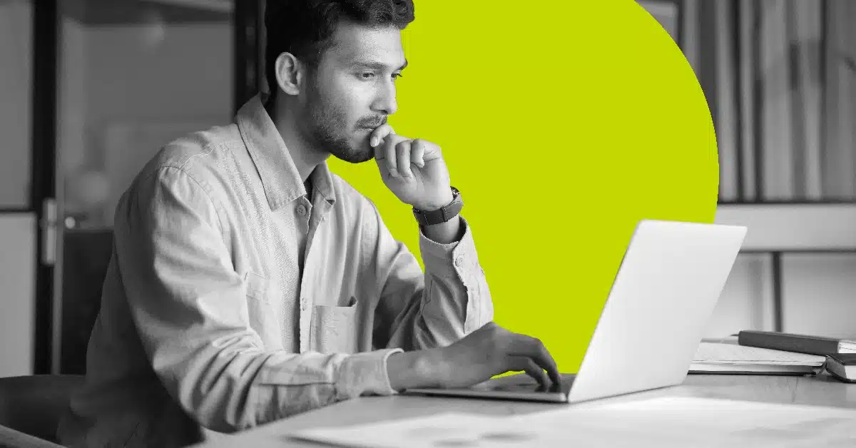 Man looking at data protection metrics on a computer screen.